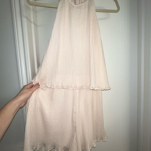 Adorable cream chiffon ruffle short romper with tie back. Open winged back. - Picture 5 of 13